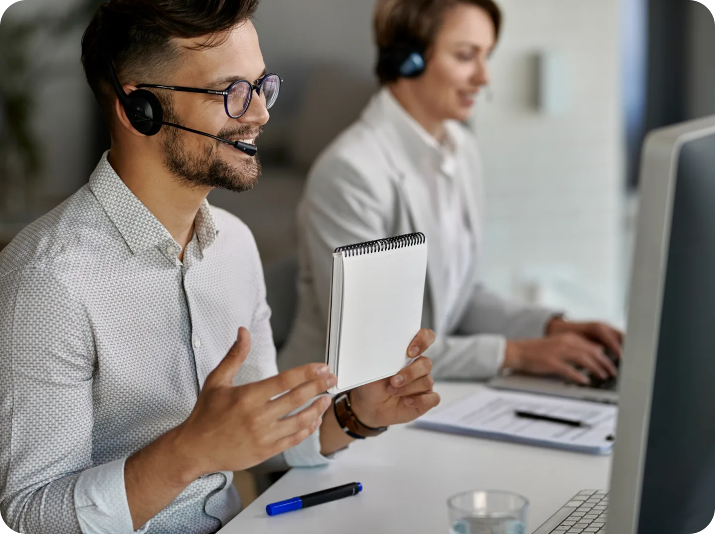Professionals having a conversation through headsets